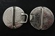 Bæltespænde af sølv
Lavet af 2 østriske mønter
Forsiden med tekst:
R-IMP-HU-BO-REG-M.THERESIA
(Mother Theresia af Habsburg)
Nederst står: S.F.
Bagsiden: 
Med ørn og indskrift: 
BURG-CO-TYR-1780-X-ARCHID-AVST-DUX
Også med inskriptioner på kant
